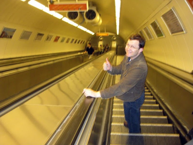 going down a subway escalator in budapest