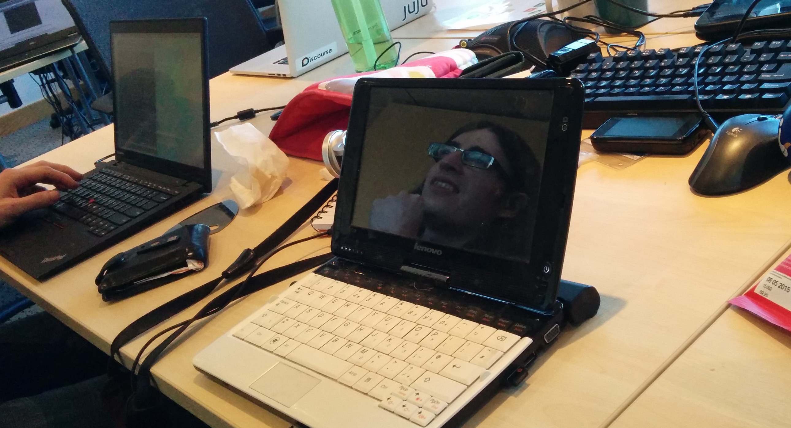 Reflection of David King in Kat's laptop screen